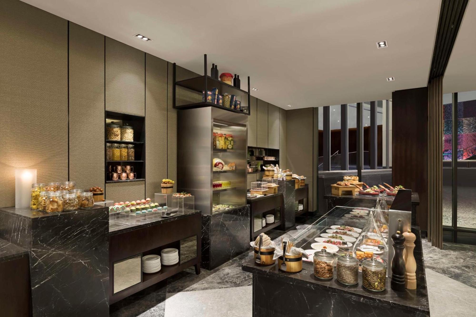 ホテル Hilton Bengaluru Embassy Manyata Business Park エクステリア 写真